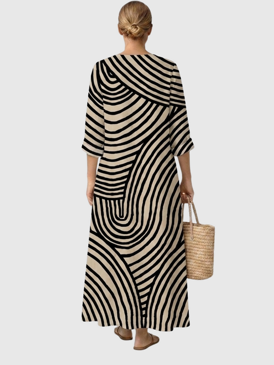 Vestido midi de rayas onduladas blanco y negro, escote V y mangas 3/4