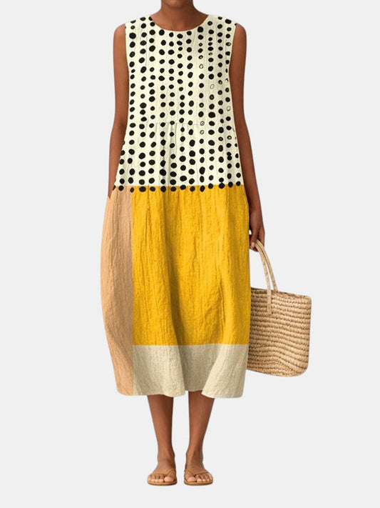 Vestido midi sin mangas con puntos negros, franja mostaza y falda beige