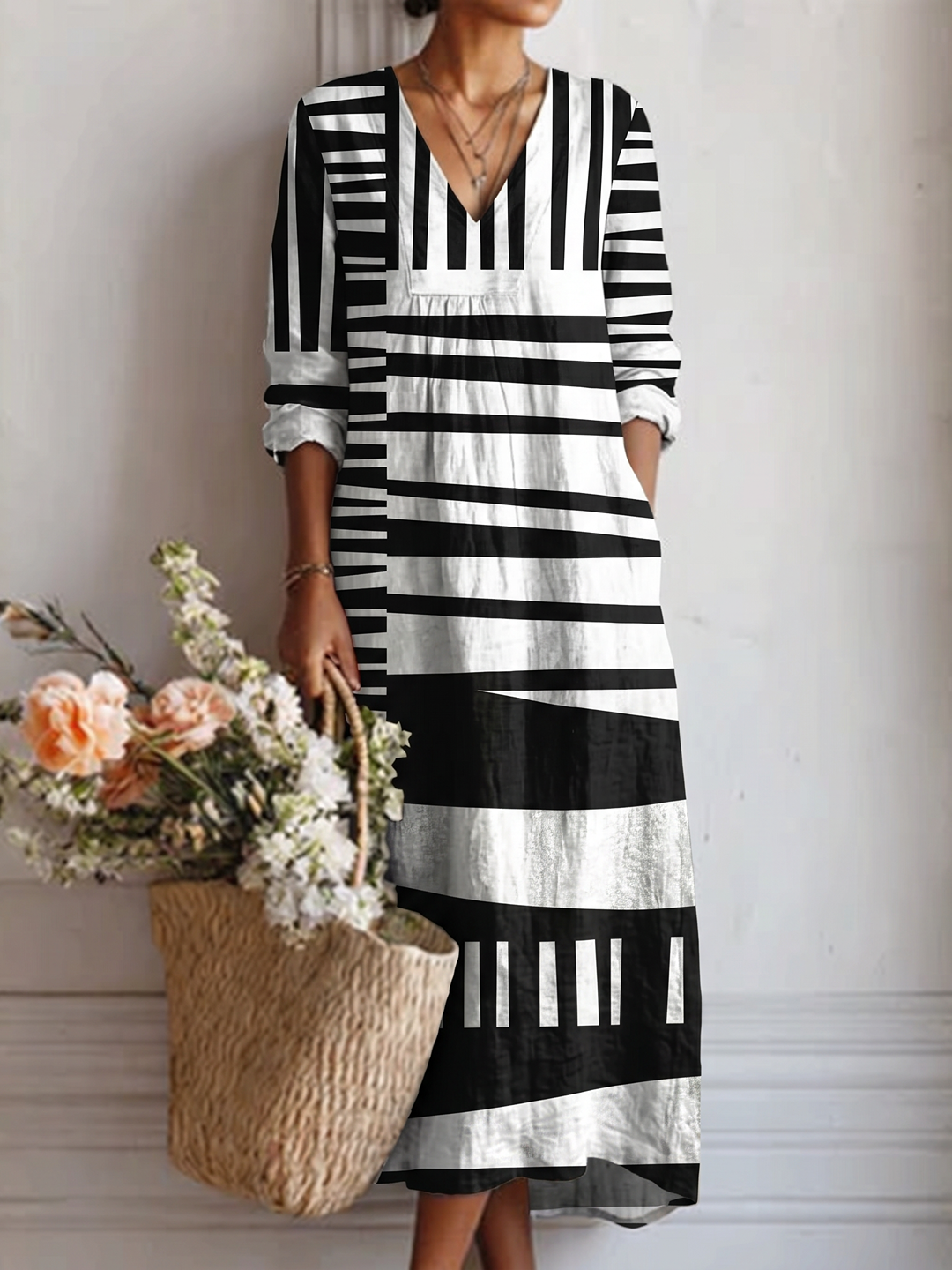 Vestido midi con escote en V, estampado gráfico blanco y negro, mangas 3/4
