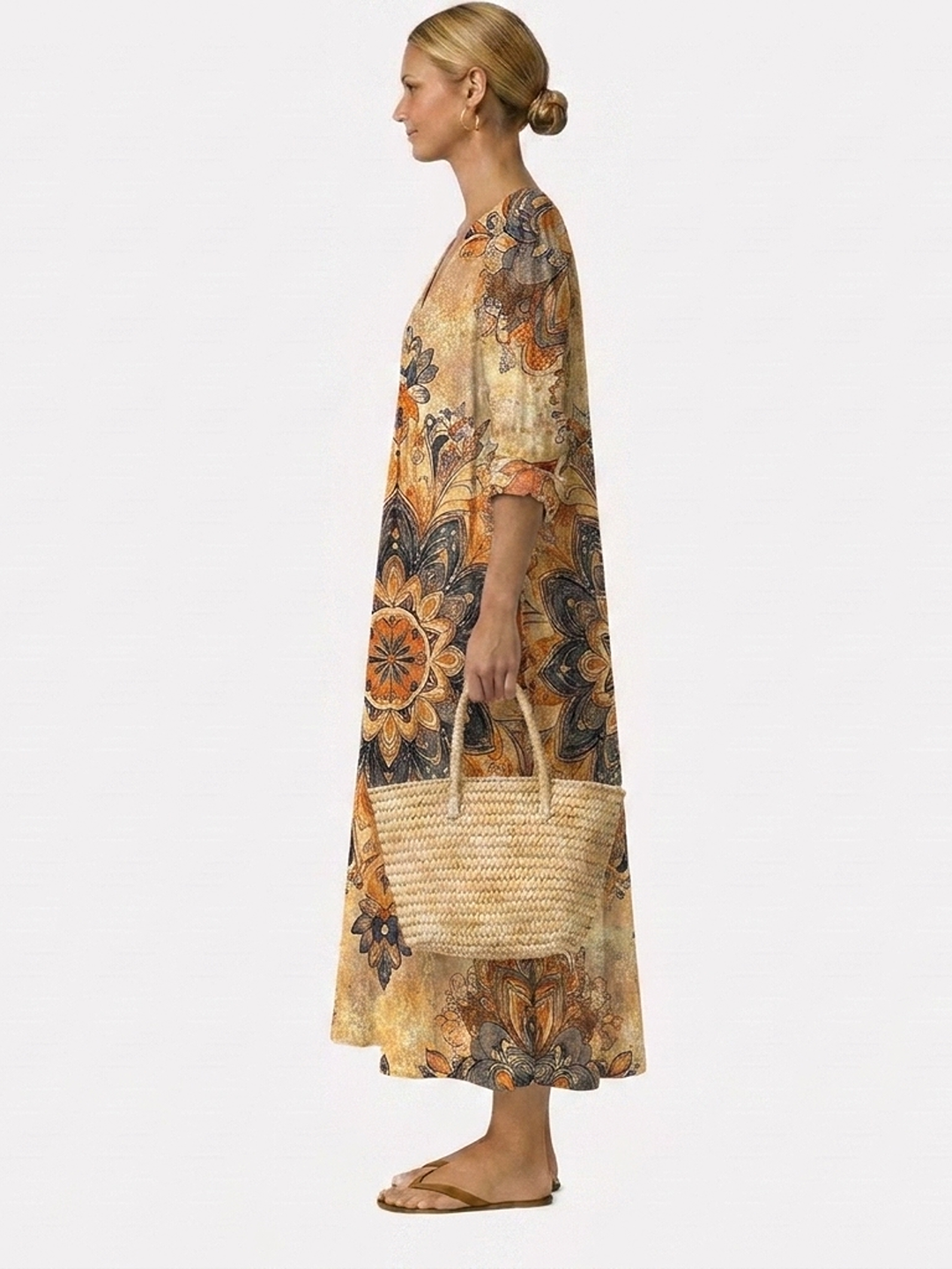 Vestido midi estampado floral con manga tres cuartos, corte recto y caída suelta